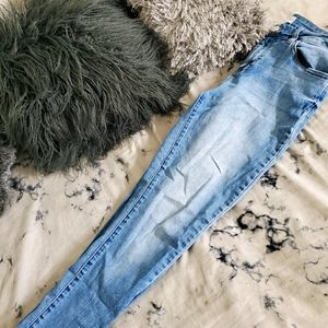 Light washed blue denim jeans by Ashley Mason